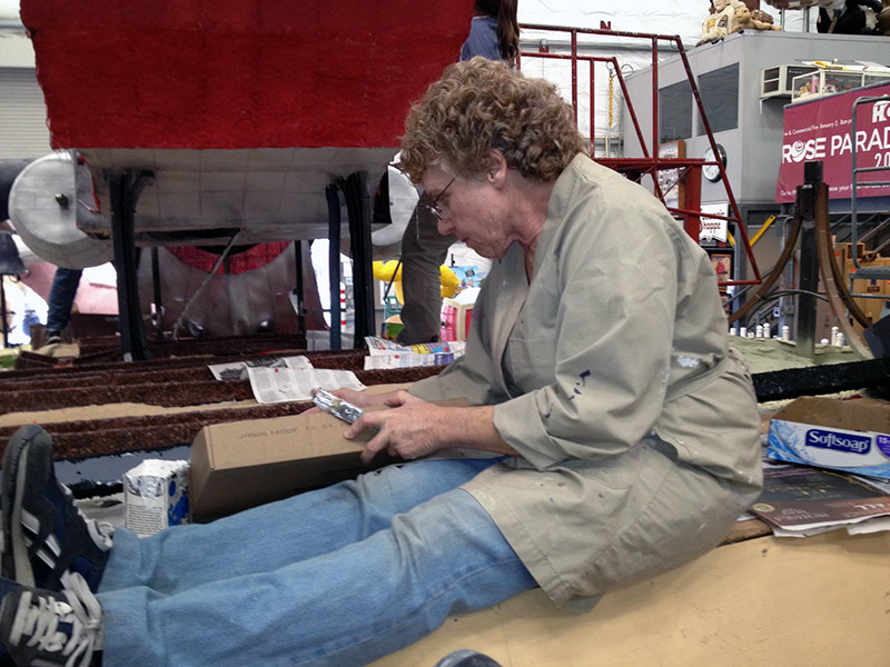 Upper loft Carol decorating the float