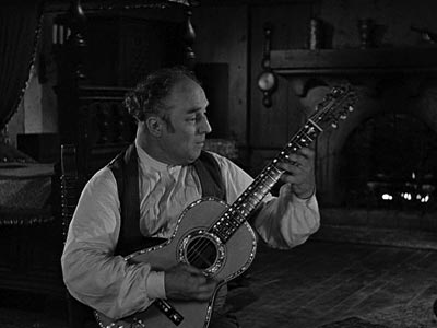 Bernardo plays the guitar, pretending to be Diego